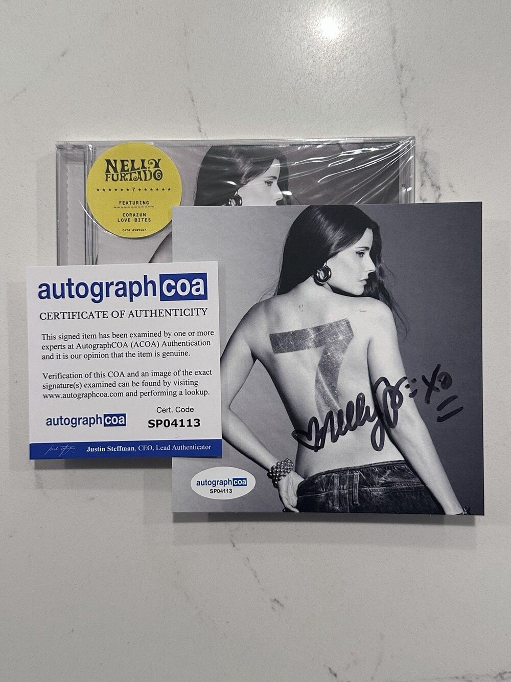 Nelly Furtado Signed - 7 CD + Signed Art Card (Love Bites) AUTOGRAPHED COA #5